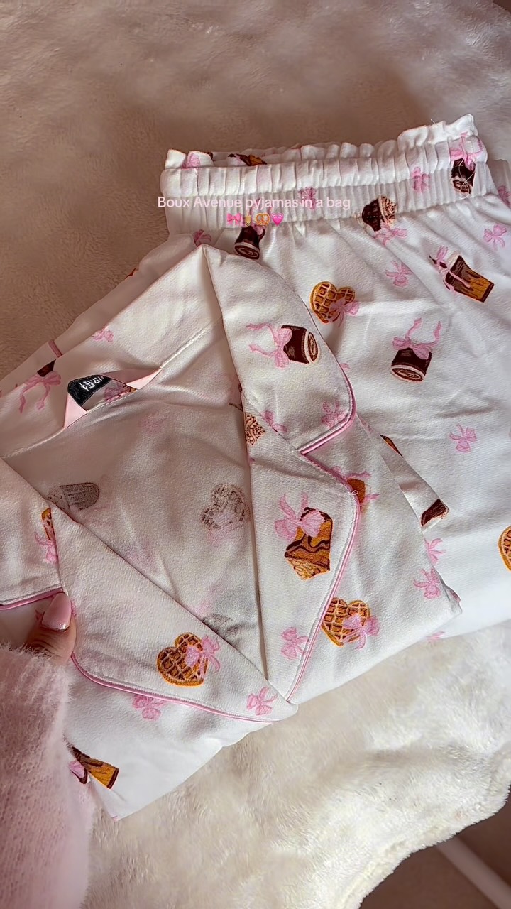 Boux Avenue ad: These are literally the cutest pyjamas from @bouxavenue 🧋🎀💗 they are so soft and cozy. I love this cute idea of pyjamas in a bag , so cut