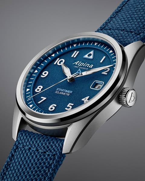 Alpina ad: A signature detail, with a Solarmetre twist.⁣ ⁣ For the Startimer Pilot Solarmetre, Alpina’s iconic triangle leaves its traditional red behi