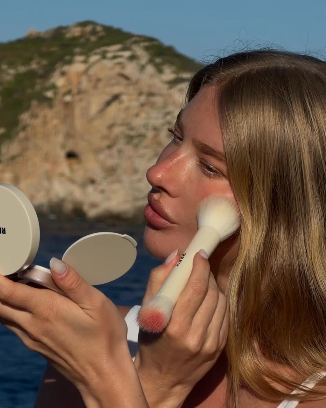 REFY ad: Sheer, water-based bronzer and blushes that melt seamlessly into skin. Discover the Watercolor Collection - skin first formula, effortless t